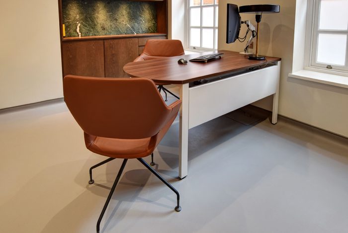 Single office desk with meeting space